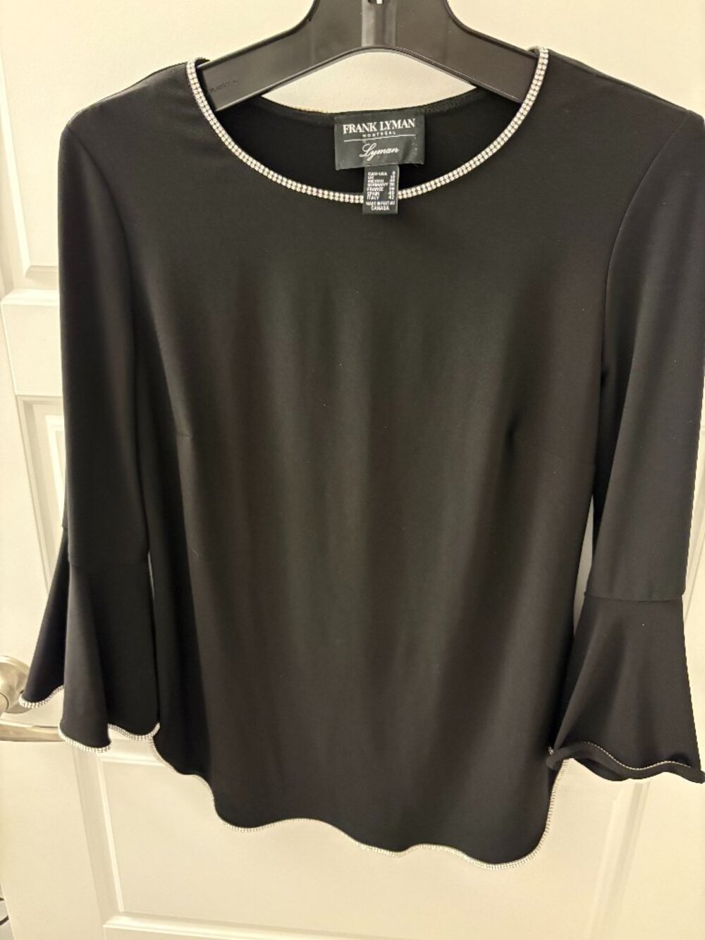 FRANK LYMAN Chic black top by Frank Lyman Design Size 8